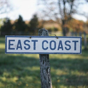 East Coast wood sign on tree